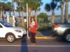 Rona Brinlee of The Bookmark in Neptune Beach, Florida, gave books to drivers lined up for the ferry.
